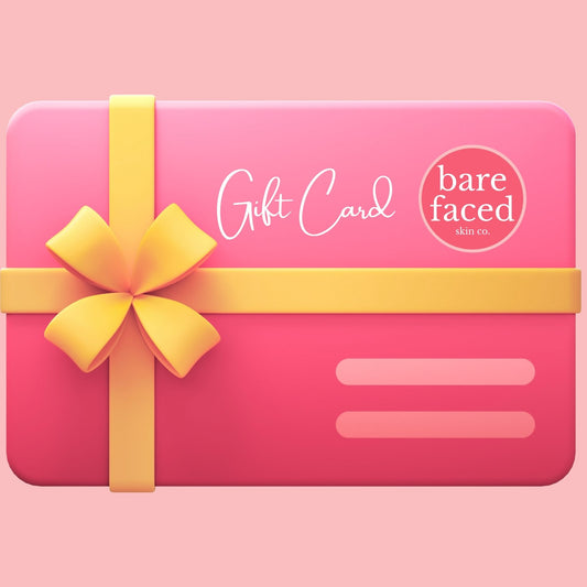 Bare Faced Skin Co.™ pink gift card with yellow bow, fun and playful beauty gift voucher on pink background