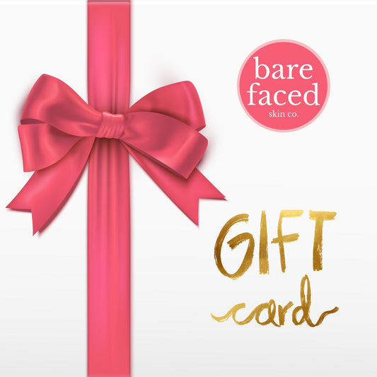 Bare Faced Skin Co.™ white gift card with pink ribbon bow, classic beauty gift option